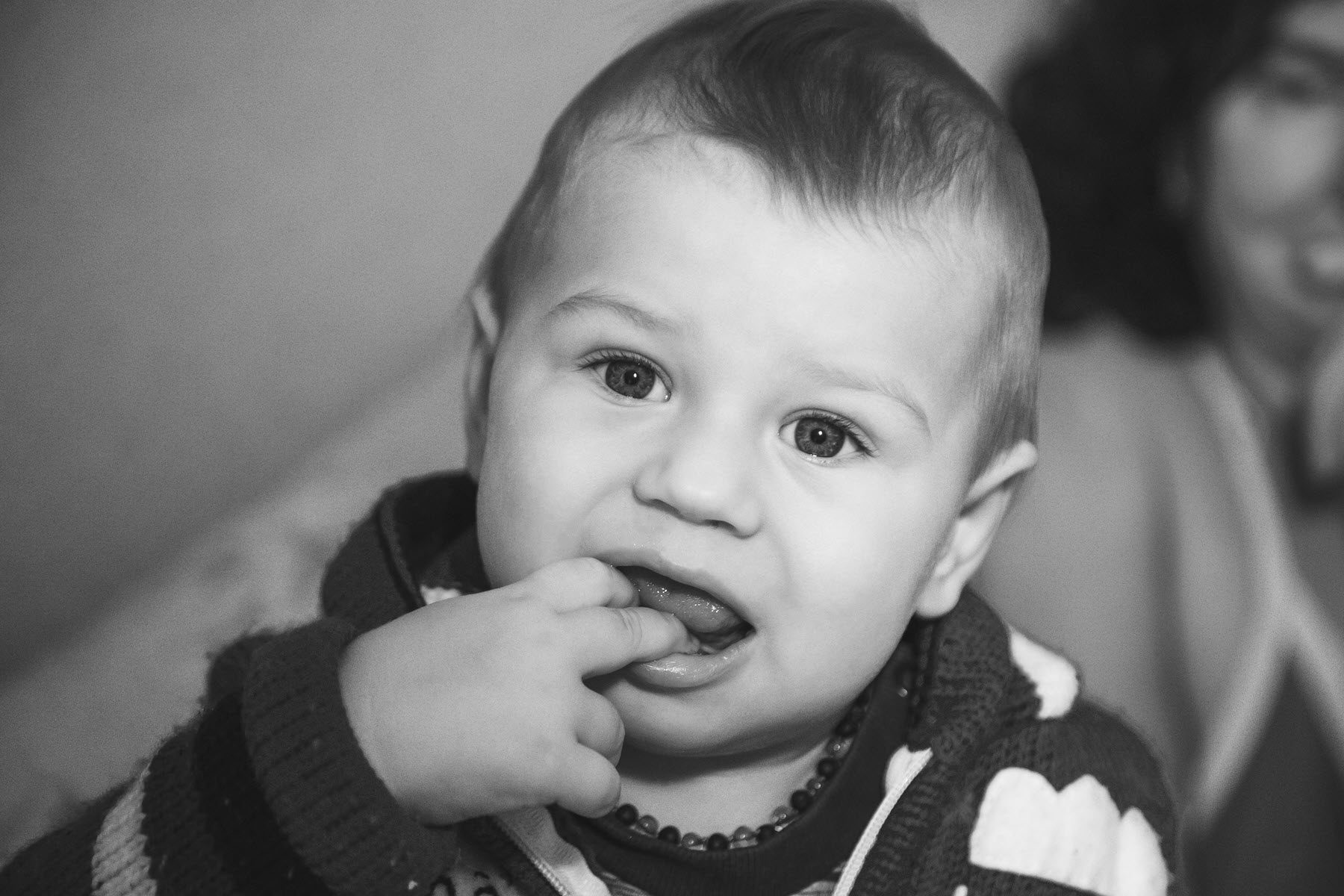 Baby touching face due to tooth pain