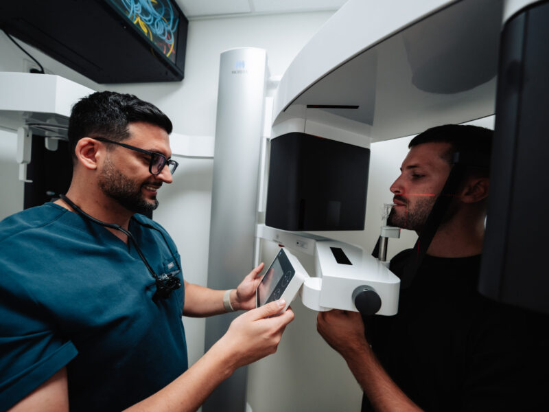 Patient undergoing a Wisdom Tooth 3D Scan with a dentist preparing the imaging procedure